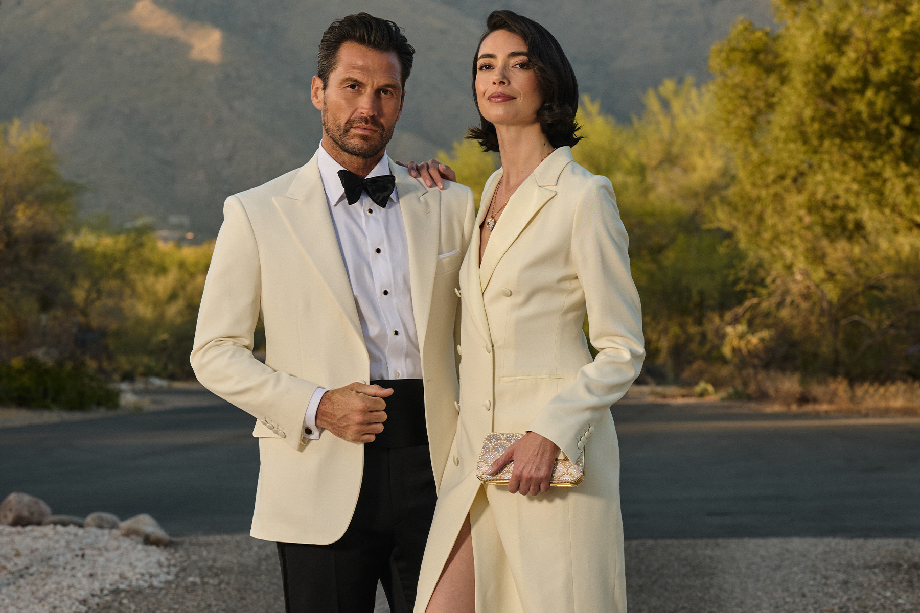 Men and women in custom formal wear at a formal event